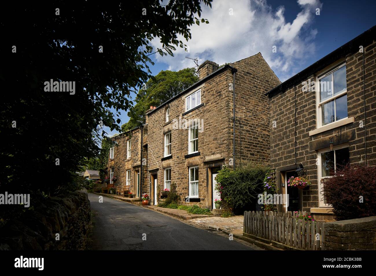 Hayfield village, High Peak, Derbyshire, typical 3 story houses on `Spring Vale Road Stock Photo